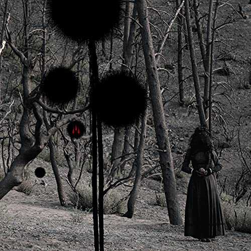 Dark forest scene with a figure and three black, spiky orbs.