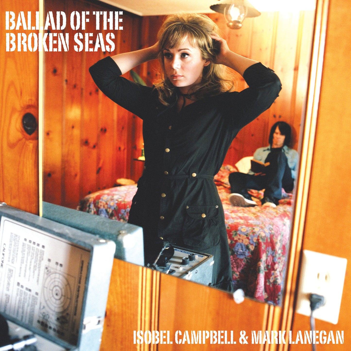 CD cover: woman in black dress looking in a mirror.