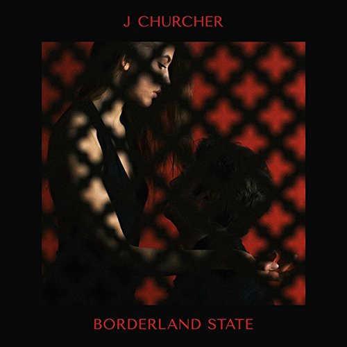 Album cover: couple silhouetted against a red diamond-patterned background.