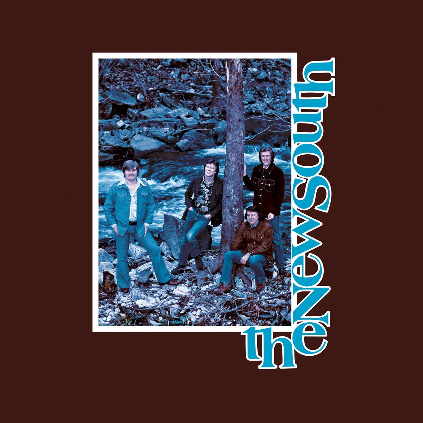 Album cover featuring a band of four people in a wooded area.
