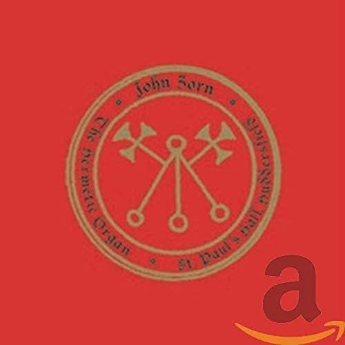 Red CD cover with a gold circular emblem and abstract symbol.