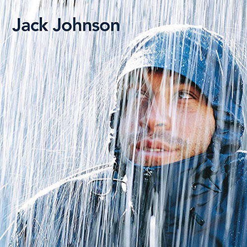 Jack Johnson portrait, wearing a blue hooded jacket in the rain.