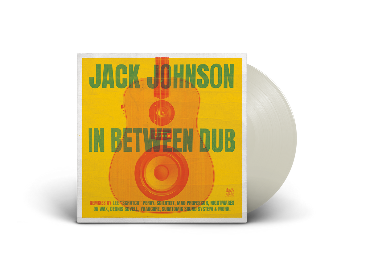 "White vinyl record with yellow album cover featuring a guitar and green text."