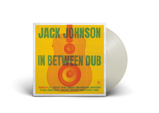 "White vinyl record with yellow album cover featuring a guitar and green text."
