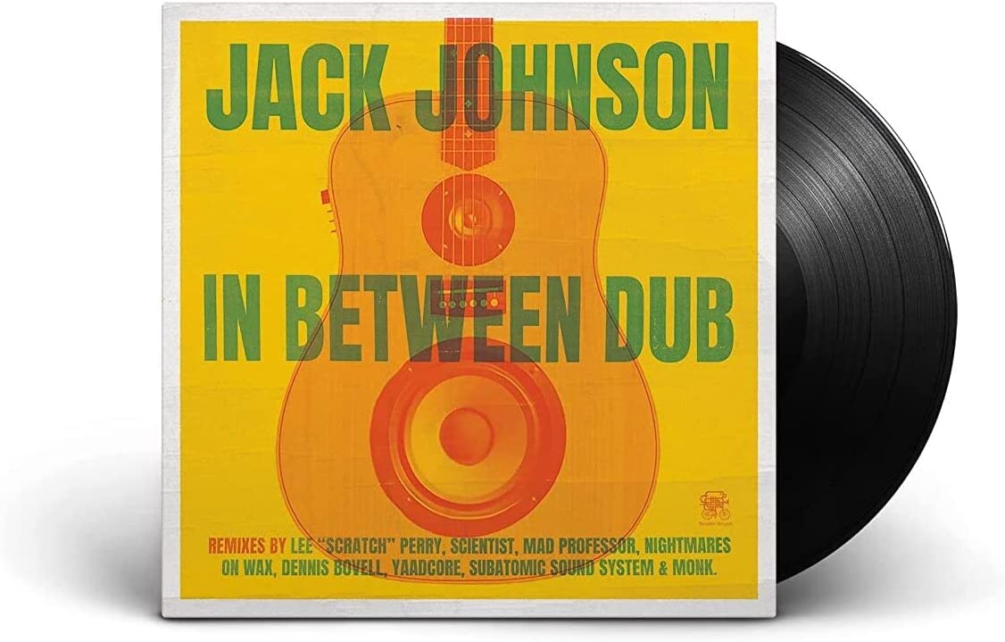 "Vinyl record with yellow cover featuring a guitar and speaker design, titled 'In Between Dub'."