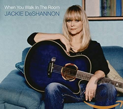 Jackie DeShannon with acoustic guitar on album cover.