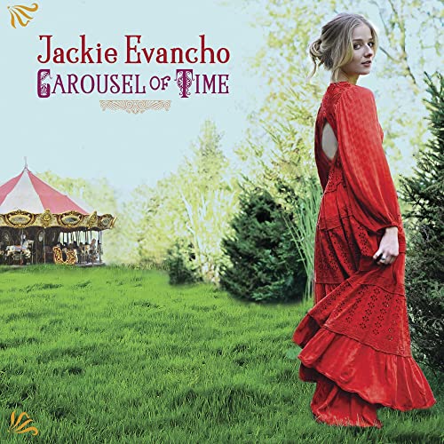 Jackie Evancho album cover featuring a woman in red by a carousel.