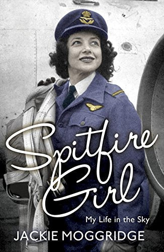 A woman in a pilot uniform stands before an aircraft, holding a parachute harness.