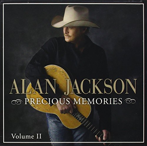 Alan Jackson in a cowboy hat holding a guitar, album cover.