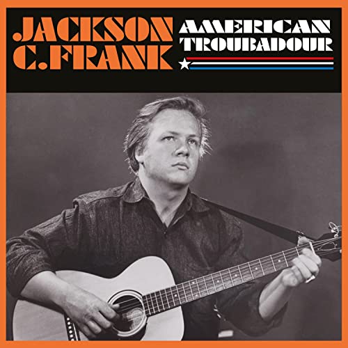 Black and white portrait of Jackson C. Frank with a guitar.