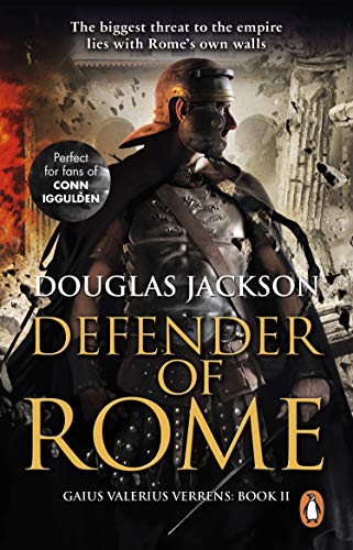 A Roman soldier in armor stands before crumbling stone ruins with fire in background.