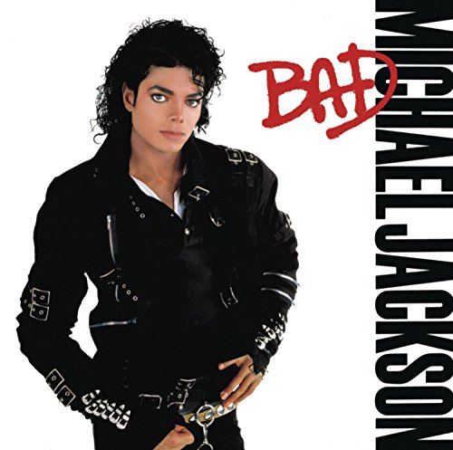 Michael Jackson wearing a black buckled jacket on the Bad album cover.