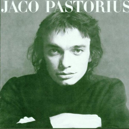 Portrait of Jaco Pastorius, a musician with wavy hair, on album cover.