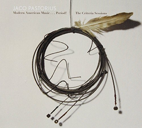 "Album cover with coiled bass strings and a feather on a beige background."