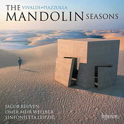 CD cover: desert landscape with a modern concrete structure and a figure.
