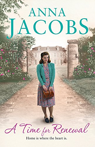 A woman in a floral dress and cardigan stands on a path before a manor.