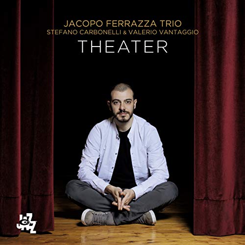 CD cover: man seated between red curtains, album title "Theater".