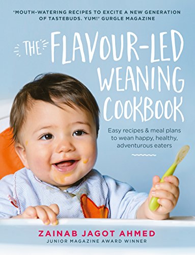 Cookbook cover featuring a smiling baby with food on their face.