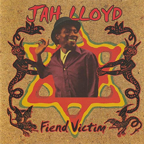 CD cover: Jah Lloyd portrait with demonic figures and starburst design.