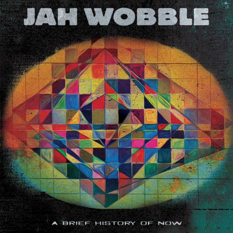 Jah Wobble album cover: colorful geometric design on a dark background.