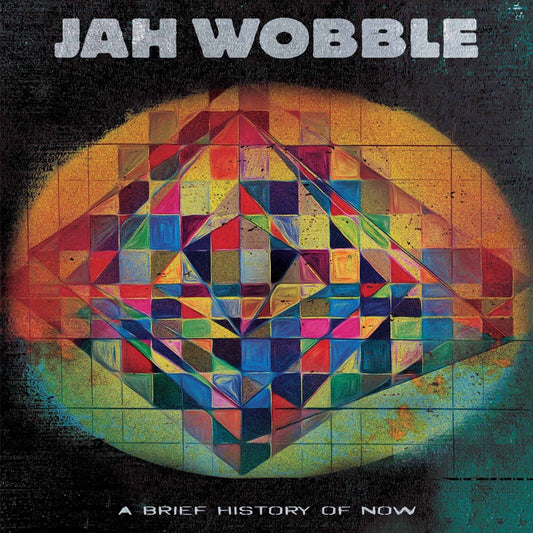 Album cover for Jah Wobble’s “A Brief History Of Now” with geometric design.