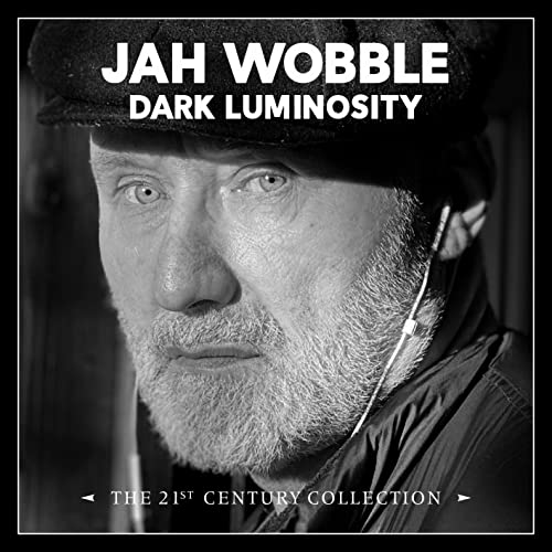 Black and white portrait of Jah Wobble, album cover for "Dark Luminosity.