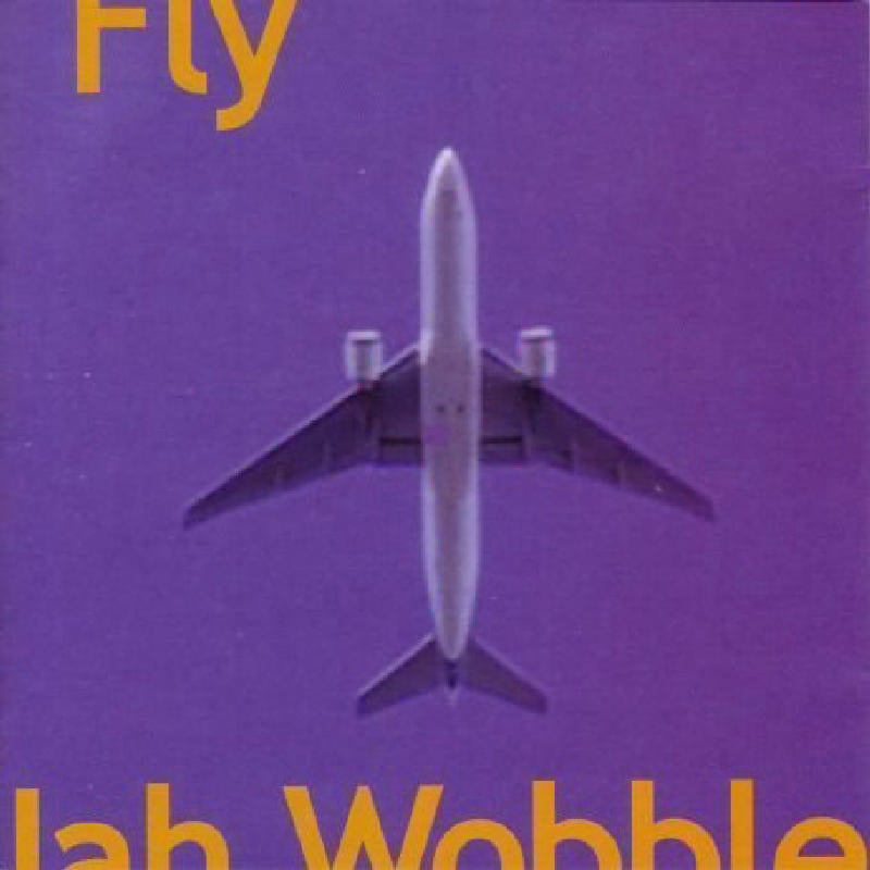Purple CD cover with a silver airplane and text “Jah Wobble Fly”.