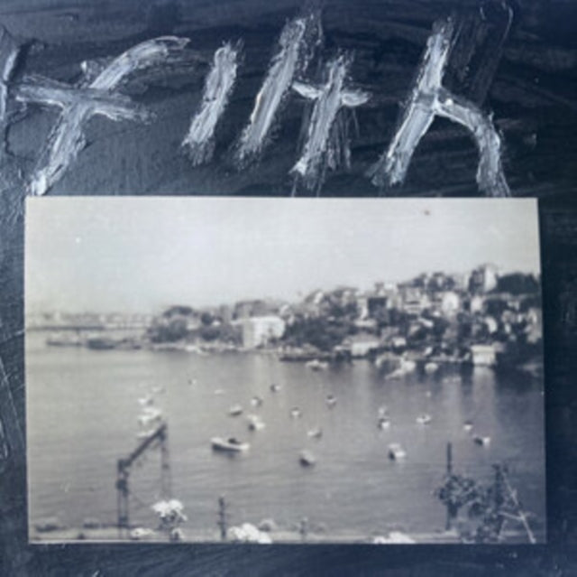 Black vinyl record with a grayscale image of a harbor town.