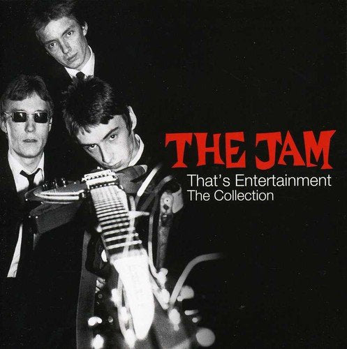 "CD cover with three men in suits and a guitar, black and white photo."
