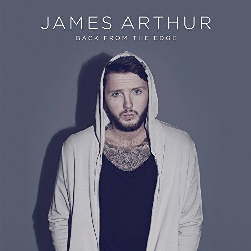 James Arthur album cover, featuring a portrait of the artist in a hoodie.
