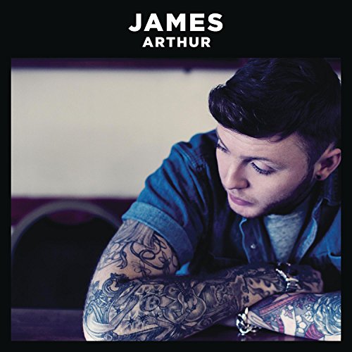 James Arthur with heavily tattooed arms looking down, album cover art.
