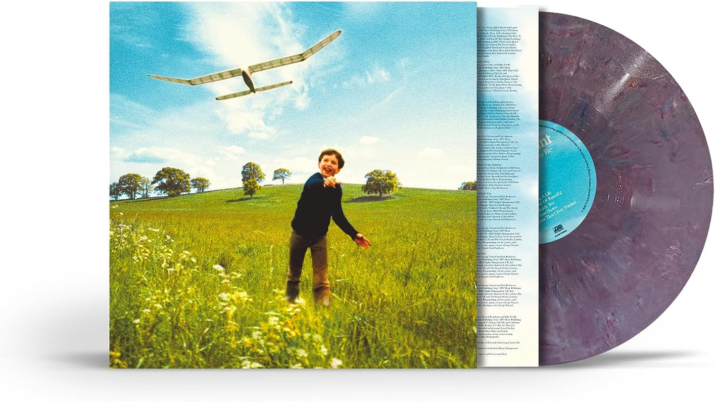 James Blunt album cover with a boy looking at a small airplane.
