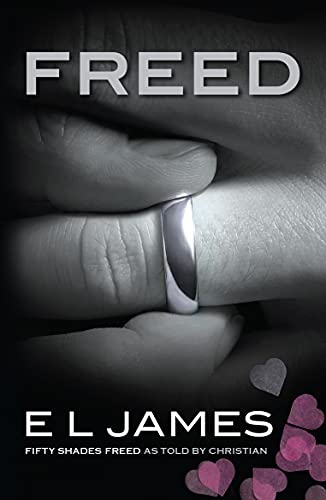Book cover: "Freed" by E L James, showing hands and a wedding ring.