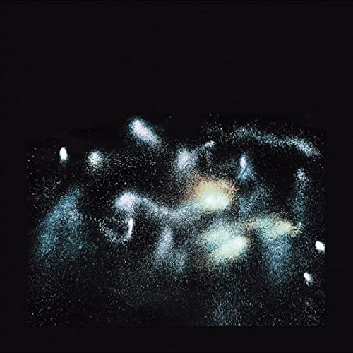 CD cover for "The Hum" featuring a blurred, starry, abstract image.