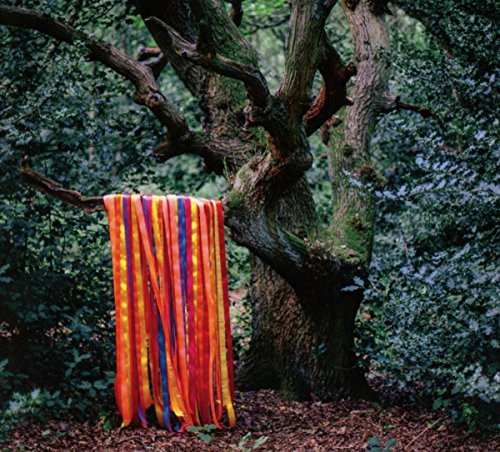 CD cover with a tree, colorful ribbons, and a forest background.