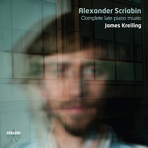 "Blurry image of a man's face with text overlay, CD album cover."