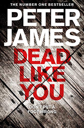 Book cover: "Dead Like You" by Peter James, red text on woodgrain.