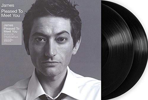 Black and white image of vinyl record album cover with a man's portrait.