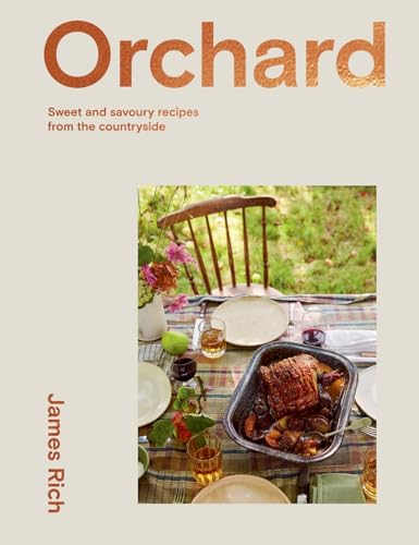 Cookbook cover with roast meat, fruit, and a garden view.