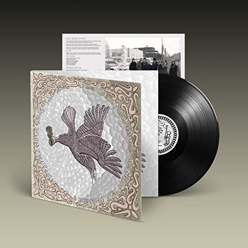 Vinyl record with ornate cover art featuring a bird in flight.