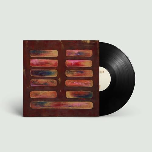 Vinyl record with abstract red and brown patterned album cover.