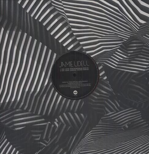 Black vinyl record with white striped sleeve, label text visible.