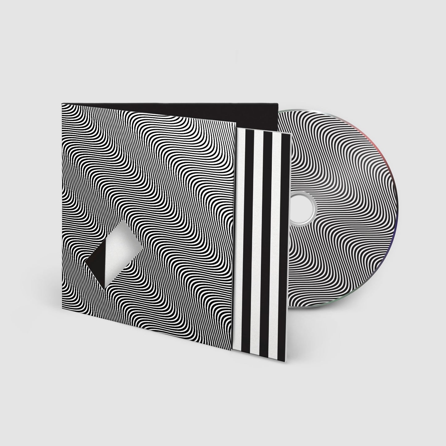 Jamie xx “In Waves” CD case with optical illusion cover art.