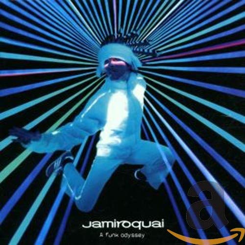 Jamiroquai album cover: man in white suit leaping amidst blue radial lines.