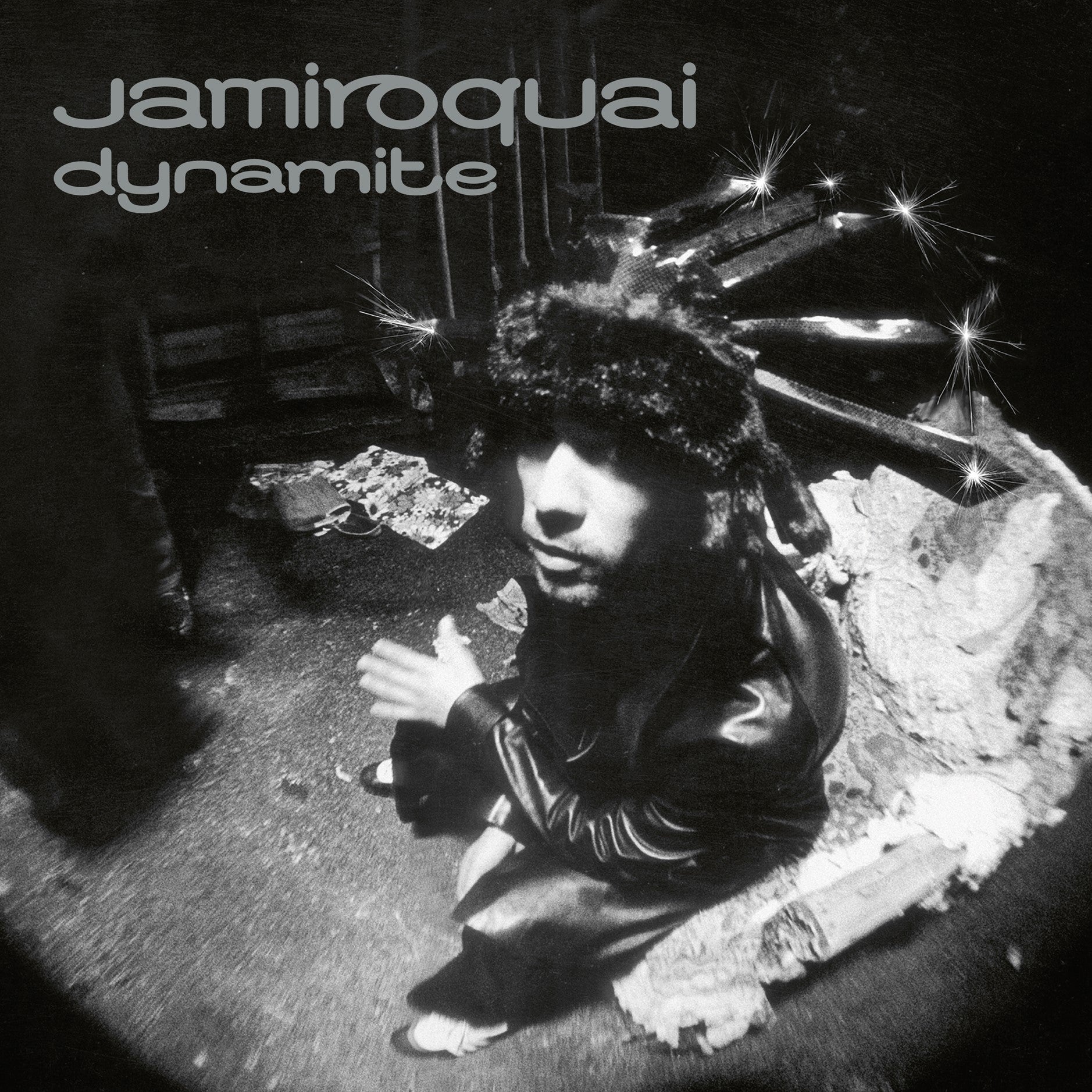 Black and white album cover featuring Jay Kay wearing a fur hat with sparkles.