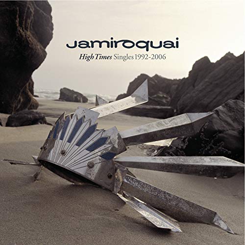 Album cover featuring a metallic headpiece on a sandy beach with darkCH rocky cliffs.