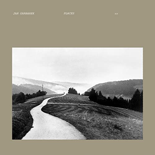 Black and white album cover with a winding road through hills.