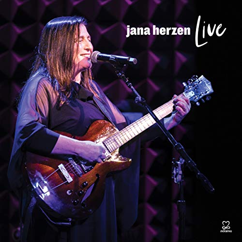 Woman with long brown hair sings and plays guitar on stage, "jana herzen Live" album cover.
