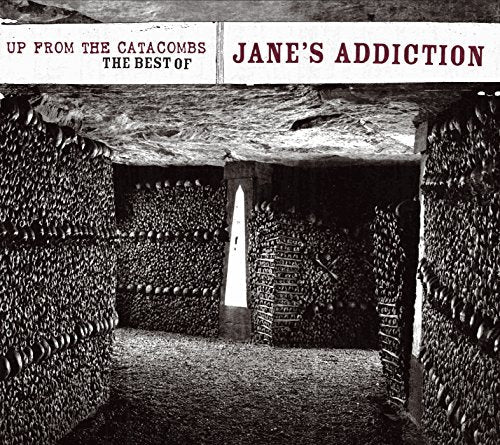 Black and white album cover depicting a tunnel lined with skulls.