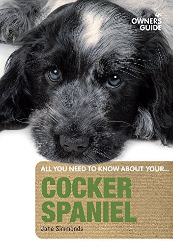 Book cover featuring a close-up of a black and white Cocker Spaniel puppy.